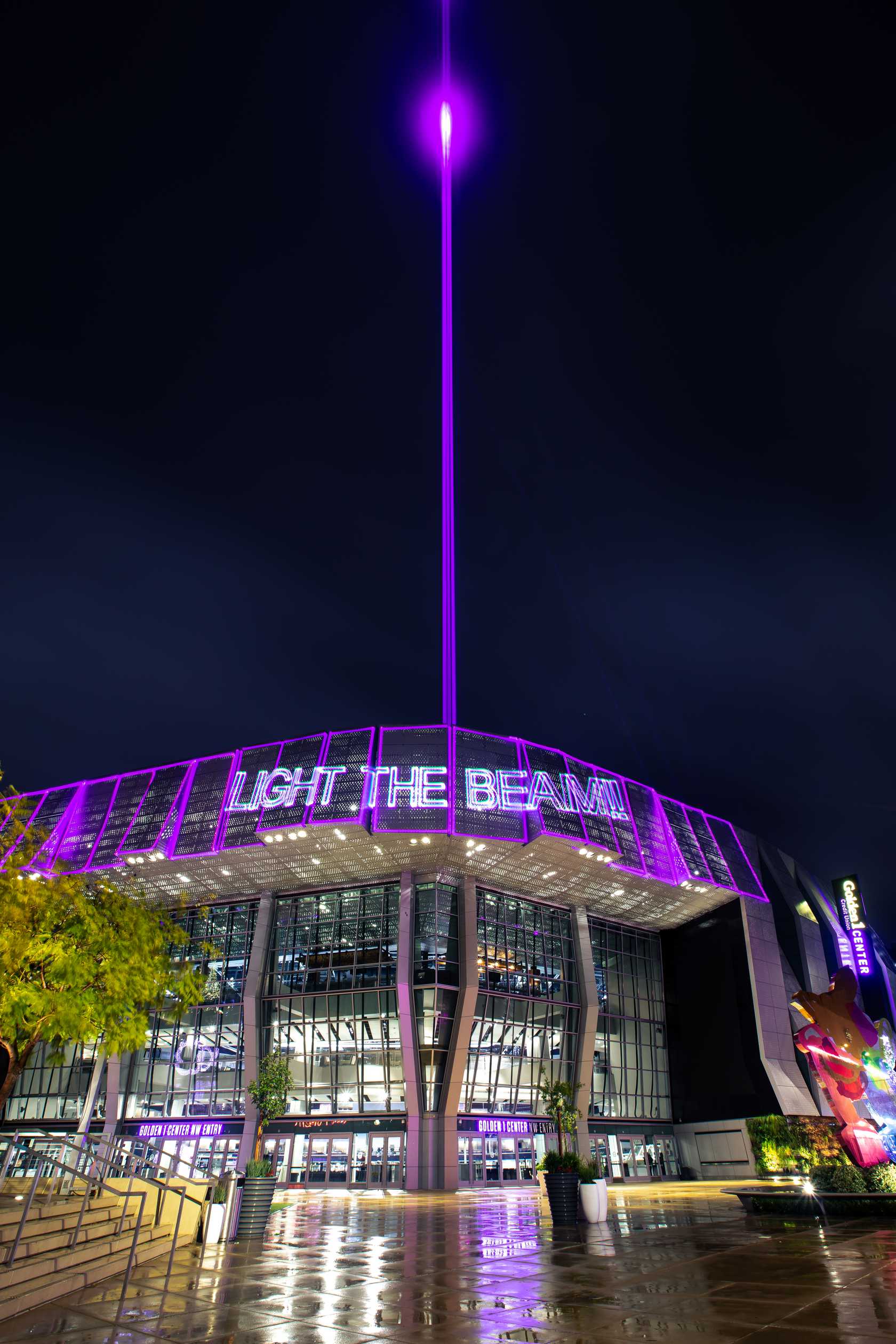 Golden 1 Center illuminated in purple with the Light the Beam installation